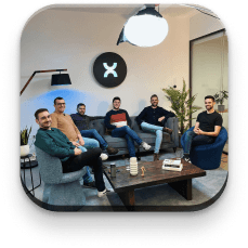 The Pixelmatters team posing on a couch at the office