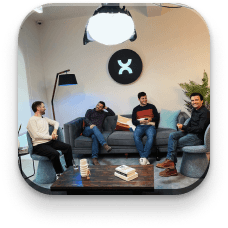 Members of the Pixelmatters team laughing on a couch at the office